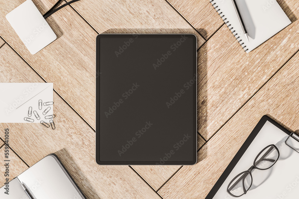 Poster top view on blank black modern digital tablet screen with place for your logo or text on wooden surf