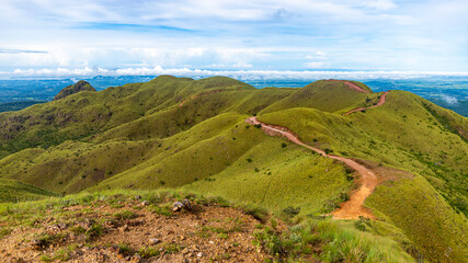 Fototapeta na wymiar panorama of Costa Rica's cerro pelado mountains during a sunny day; mighty mountains covered with green, succulent grass; mountains in the tropics amidst rainforests