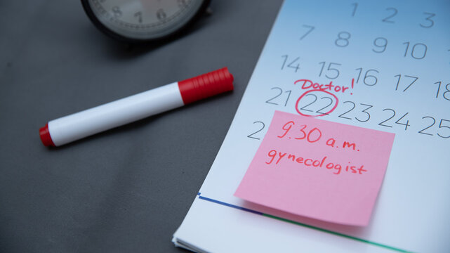 Reminder in the calendar about the appointment to the doctor, highlighted in red number in the calendar reminder of the visit to the medical office