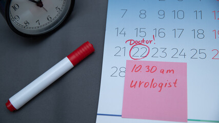 Reminder in the calendar about the appointment to the doctor, highlighted in red number in the calendar reminder of the visit to the medical office