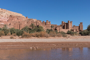 Clay fortification, cinema village, with a river in a sunny day in Ait Ben Haddou, Morocco
