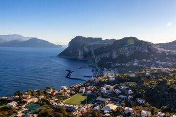 Fototapeta na wymiar Touristic Town on Capri Island in Bay of Naples, Italy. Sunny Blue Sky. Nature Background.