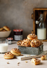 Yeast dough cookies with nuts. Homemade yeast cookies. Stack of tasty round cookies on pink background