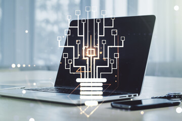 Creative idea concept with light bulb and microcircuit illustration on modern laptop background. Neural networks and machine learning concept. Multiexposure