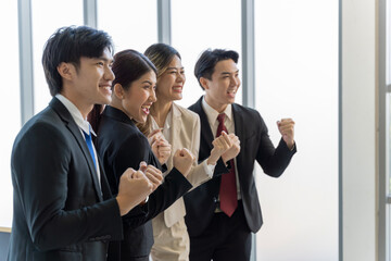 Obraz premium A group of young Asian businessmen Talking and planning work happily and have fun. at the company's office