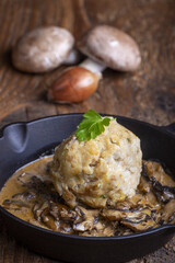 bavarian bread dumpling in mushroom sauce