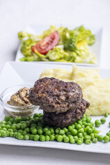 bavarian meat loafs with peas