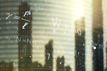 Double exposure of scientific formula hologram on modern skyscrapers background, research and...