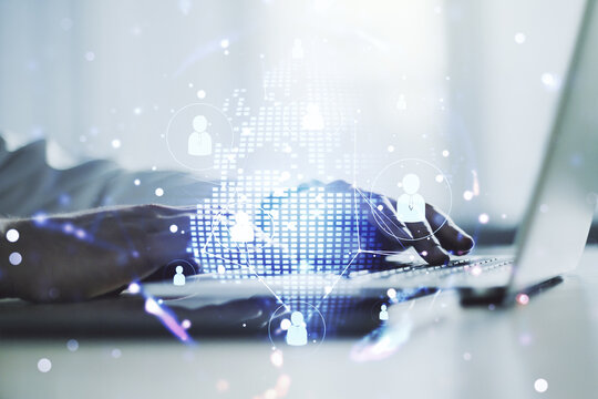 Social network concept with world map and hands typing on laptop on background. Multiexposure