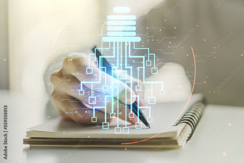 Poster creative idea concept with light bulb and microcircuit illustration and man hand writing in notebook