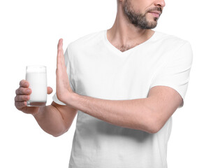 Man with glass of milk suffering from lactose intolerance on white background, closeup