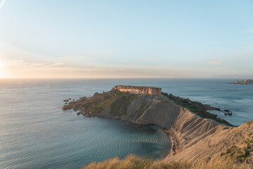 Clay cliffs and little peninsula in Malta near Ghajn Tuffieha and Qarraba Bay. 
