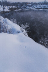 Snowy high shore of a lake in Poland
