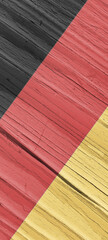 Flag of Germany on dry faded wooden surface. Phone wallpaper with German national symbol. Hard...
