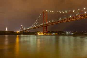 Fototapeta na wymiar Long exposure photo of the 25th of April bridge in Lisbon, Portugal