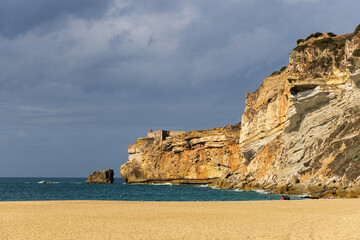 Fototapeta premium South beach of Nazaré and the fort of São Miguel Arcanjo