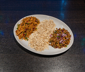 Nepalese food with chicken and peas, flat rice 