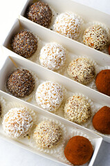 Assorted vegan sweets, Delicious Candy Balls with seeds, dried fruit and cocoa powder, Healthy Candies