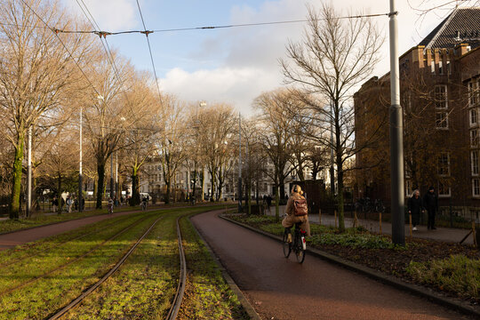 Bikers in Wertheimpark in Amsterdam. Beautiful view, green grass, good weather.