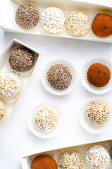 Assorted vegan sweets, Delicious Candy Balls with seeds, dried fruit and cocoa powder, Healthy Candies