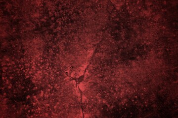 A textured background featuring deep red tones with a distressed, grunge appearance. The surface shows scratches and uneven patterns, creating a vintage feel.