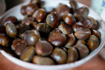 Detail of a bowl full of chestnuts in a traditional kitchen