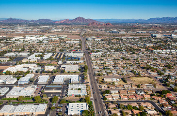 Aerial view looking north along Priest Drive at desert landmarks