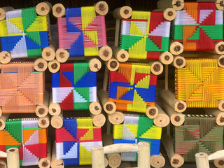 Colourful geometric patterns, very colourful stools to sit on, handmade, street sales, products...