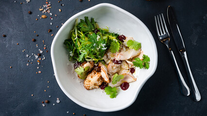 Salad with turkey, cauliflower, arugula, lettuce, parmesan cheese, parsley and cranberry sauce.