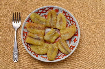 plate with chinese dessert fried banana slices