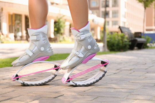 Woman Keeps Pink Kangoo Jumps Boots in Hand and Shows Thumbs Up Stock Photo  - Image of activity, female: 125151176