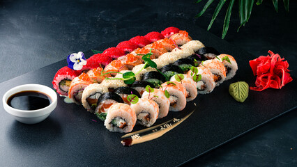Assorted Japanese sushi roll set with salmon, tuna, eel, avocado, Philadelphia cheese, cucumber,...