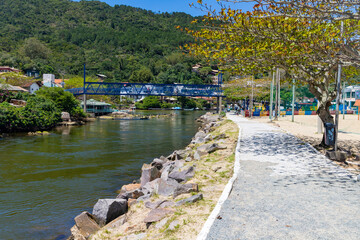 Vegetation, bridge and walk lane around Barra da Lagoa canal
