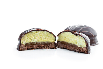 Chocolate covered cookie with pear souffle isolated on white