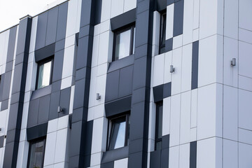 Office building with white aluminum composite panels. Facade design building with metallic aluminum...