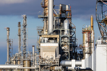 Industrial facility at a refinery with smokestacks for fuel production