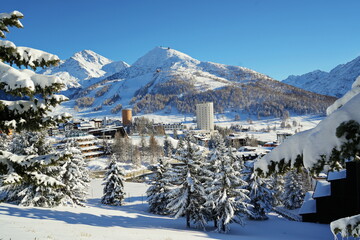 Fototapeta Overview of the snow-covered alpine village of Sestriere, which was the site of the Winter Olympics in 2006. Sestriere, Piedmont, Italy obraz