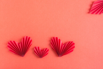 Monochrome red background with origami hearts. Family concept. St. Valentine's Day.