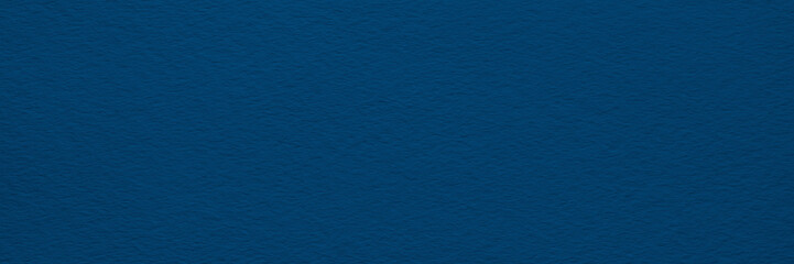 abstract dark blue wide panorama background on texture canvas or paper as blank, template, page or web banner