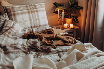 cozy scandinavian bedroom interior in natural tones, real life mess disorder