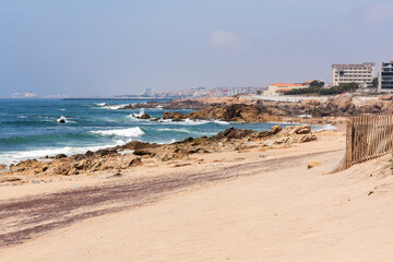 Fototapeta na wymiar Cityscape from rocky beach, North of Portugal