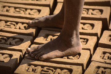 Bare foot on blocks