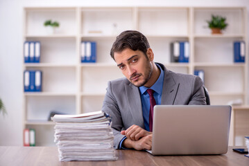 Young male employee working in the office