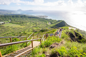 Honolulu, Hawaii - December 27, 2022:  Tourists hiking on the Diamond Head lookout trail.