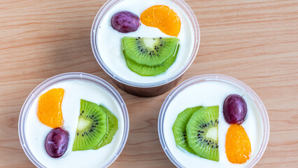 Fruity milk pudding, sweet chocolate silk pudding dessert with fruit topping