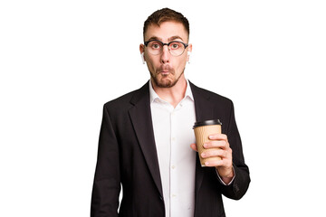 Young business caucasian man drinking a coffee isolated cutout shrugs shoulders and open eyes...