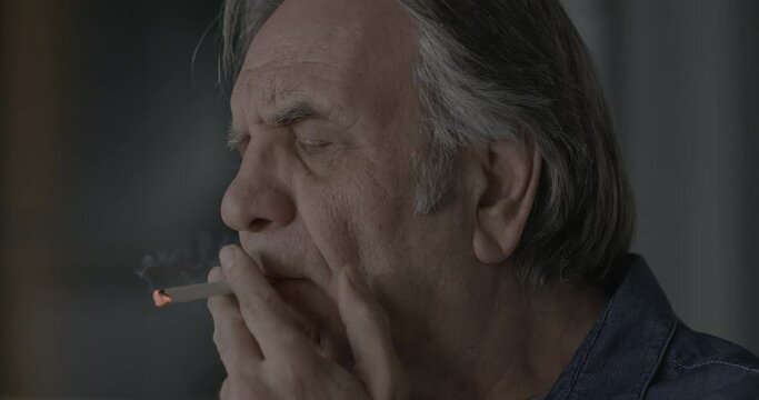 Old man smoking a cigarette