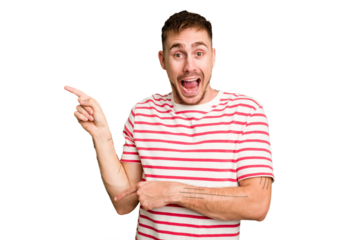Young caucasian man cut out isolated excited pointing with forefingers away.