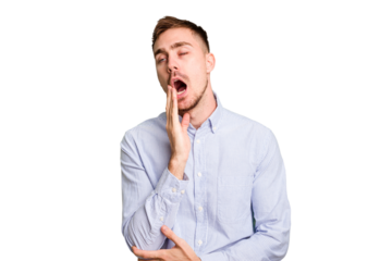 Young caucasian man cut out isolated yawning showing a tired gesture covering mouth with hand.