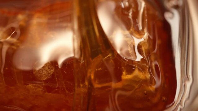 Flower honey . detail and fragment of liquid fresh honey. High quality 4k footage